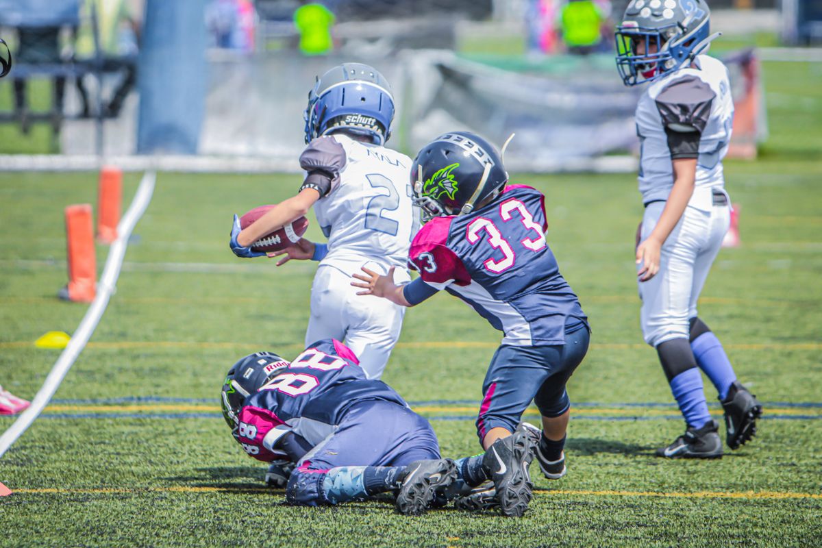 Young football players competing on the field
