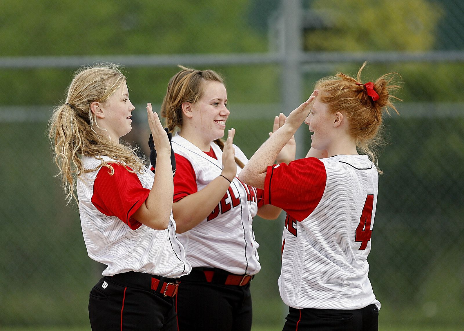 Youth softball players on the field